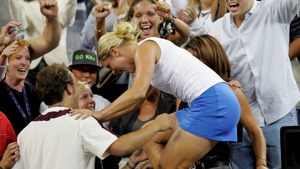 Clijsters had a love affair with New York. Here she climbs into the family area after the 2005 U.S. Open final after beating France&#39;s Mary Pierce 6-3 6-1 to clinch her first grand slam title.