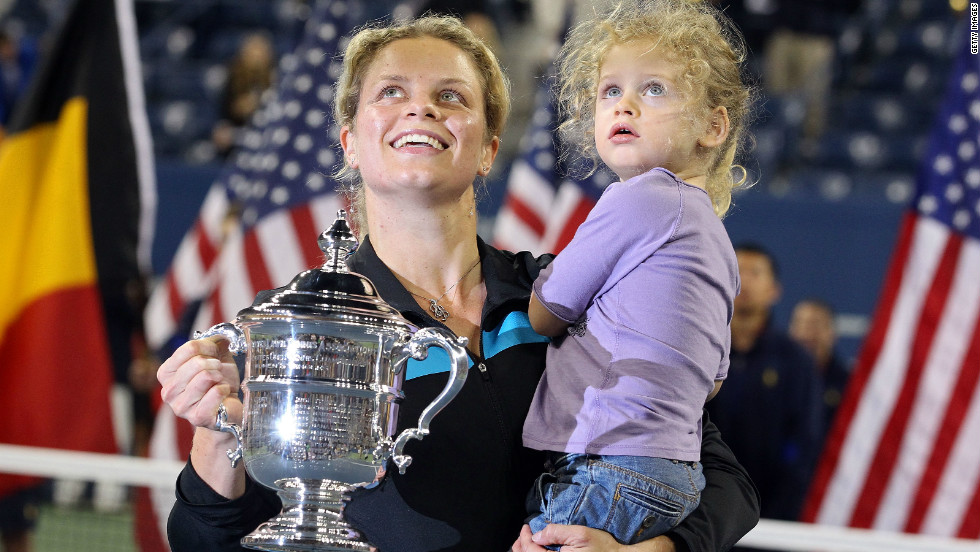 Kim Clijsters with daughter Jada and the 2010 U.S. Open trophy after beating Vera Zvonareva in the final.
