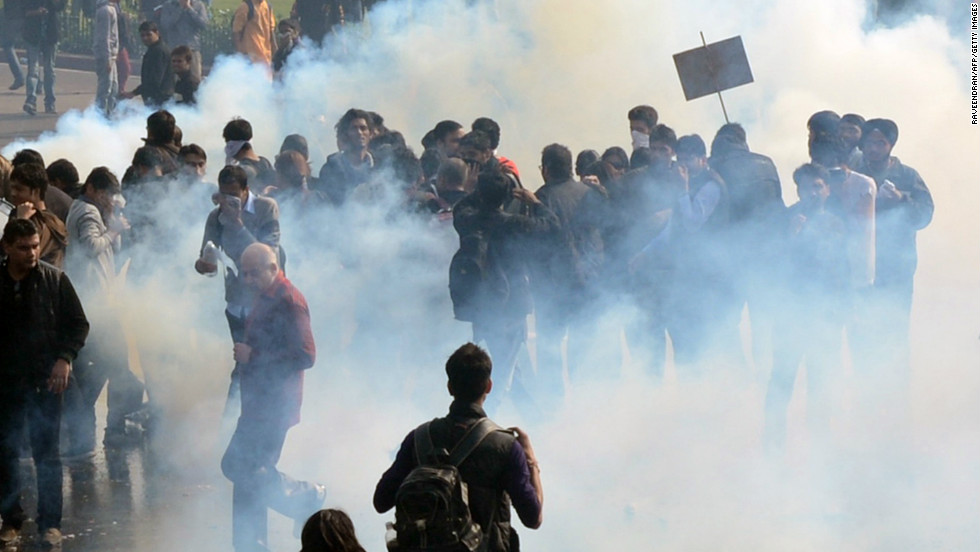 Demonstrators react from tear gas fired by police on December 22. New Delhi alone reported 572 rapes last year and more than 600 in 2012.