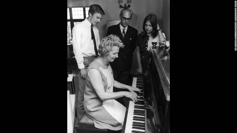 Thatcher plays the piano for her husband, Denis, and their twins, Mark and Carol, then 17, in September 1970. 