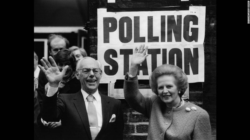 Thatcher and her husband, Denis, wave to the crowd at a London polling station in June 1987. She was re-elected to another term as prime minister that year with a slightly reduced majority.