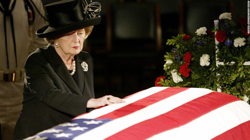 Thatcher touches the flag-draped coffin of Reagan as he lies in state in the U.S. Capitol Rotunda in June 2004.  In a prerecorded video at his funeral, she called Reagan &quot;a great president, a great American and a great man.&quot; &quot;And I have lost a dear friend,&quot; she said.