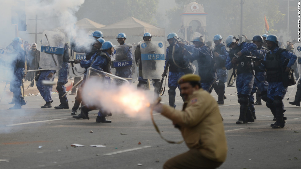 Police fire tear gas on Sunday, December 23, during a protest calling for better safety for women following last week&#39;s rape. Thousands of protesters defied a ban on demonstrations in New Delhi on Sunday, venting their anger about the incident.