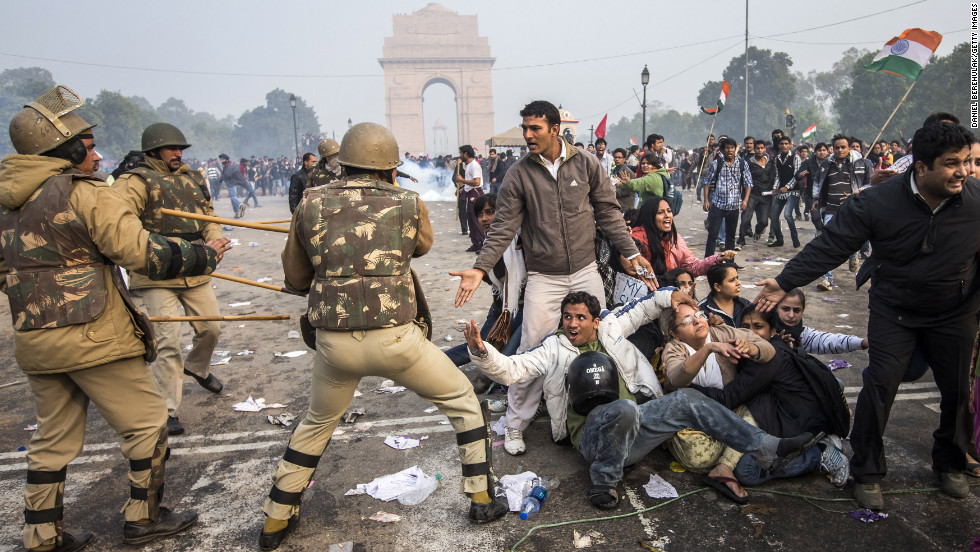 Police attempt to disperse protesters on December 23. For a second day, demonstrators were blasted with water cannons in the Indian capital. While some dispersed, others huddled tightly in a circle to brave high-pressure streams in the cold weather.