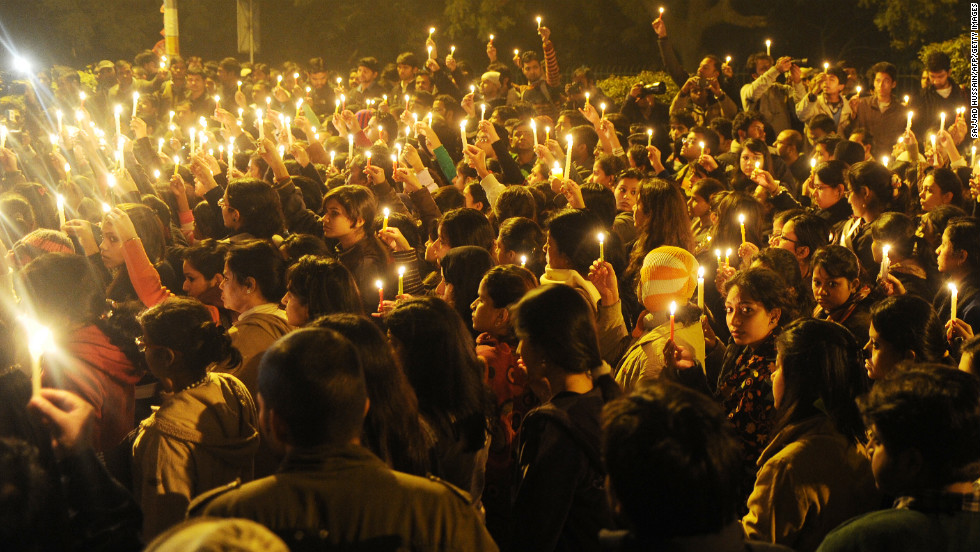 Protesters hold candles during a vigil in New Delhi on Saturday, December 29, after the death of a gang-rape victim. Authorities erected security barriers throughout New Delhi&#39;s key government district after two days of street battles following a woman&#39;s gang rape on a bus on December 16. Indian Prime Minister Manmohan Singh has appealed for calm and pledged safety for women and children.