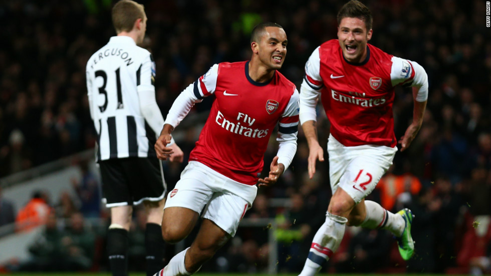 Theo Walcott (C) scored a hat-trick to inspire fifth-placed Arsenal to a 7-3 home win against Newcastle, while substitute Olivier Giroud (R) also netted twice. 