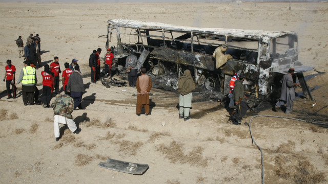 The burned out remains of the piligrim&#39;s bus that was attacked in the Balochistan province of Pakistan.