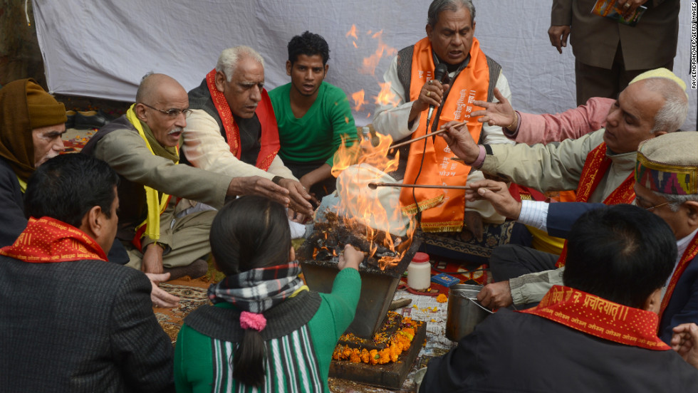 Indian demonstrators perform a prayer ritual in memory of a gang-rape victim in New Delhi on Monday, December 31. The family of the victim said they would not rest until her killers are hanged as they spoke of their own pain and trauma over a crime that has united the country in grief.