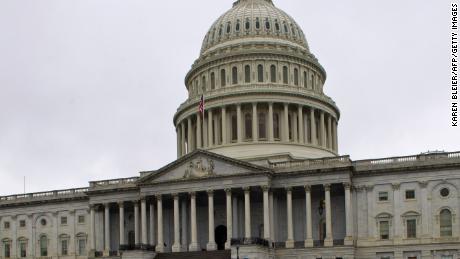 The US Capitol dome and it&#39;s reflection are seen on Capitol Hill in Washington, DC on December 29, 2012. As the fiscal cliff deadline looms, Congress and the White House have still not reached a compromise. If no deal is struck by December 31 at midnight, taxes will automatically go up on both high earners and the middle class, and across-the-board spending cuts will go into effect. AFP PHOTO/Karen BLEIER (Photo credit should read KAREN BLEIER/AFP/Getty Images) 