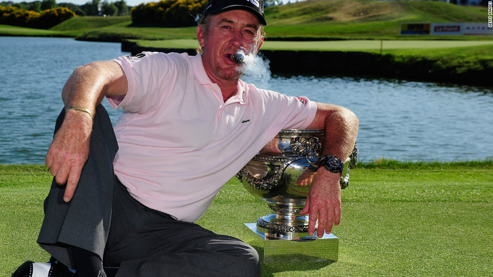 Jimenez, puffing that trademark cigar, celebrates after winning the French Open in July 2010.