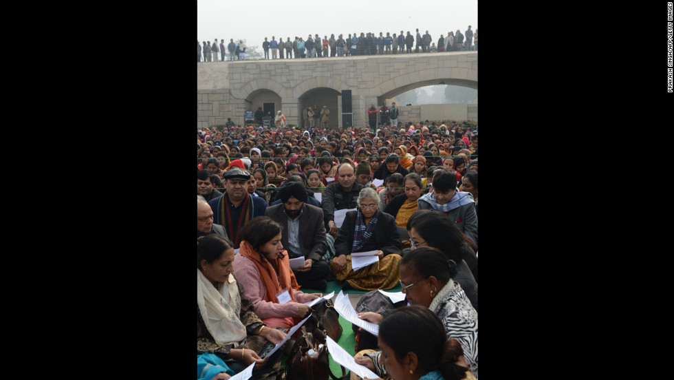 Delhi Chief Minister Sheila Dikshit, center, participates in a group prayer during the Women&#39;s Dignity March on January 2.