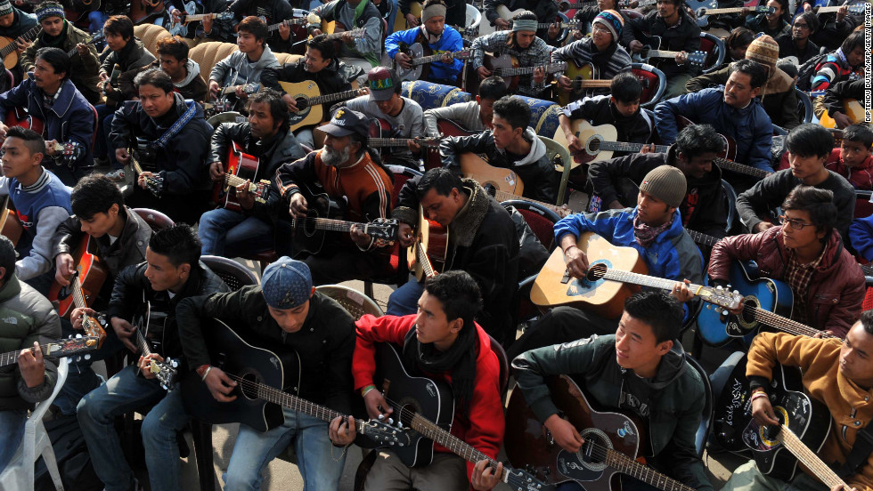 About 600 guitarists play John Lennon&#39;s &quot;Imagine&quot; in a tribute to the rape victim in Darjeeling on January 3. 
