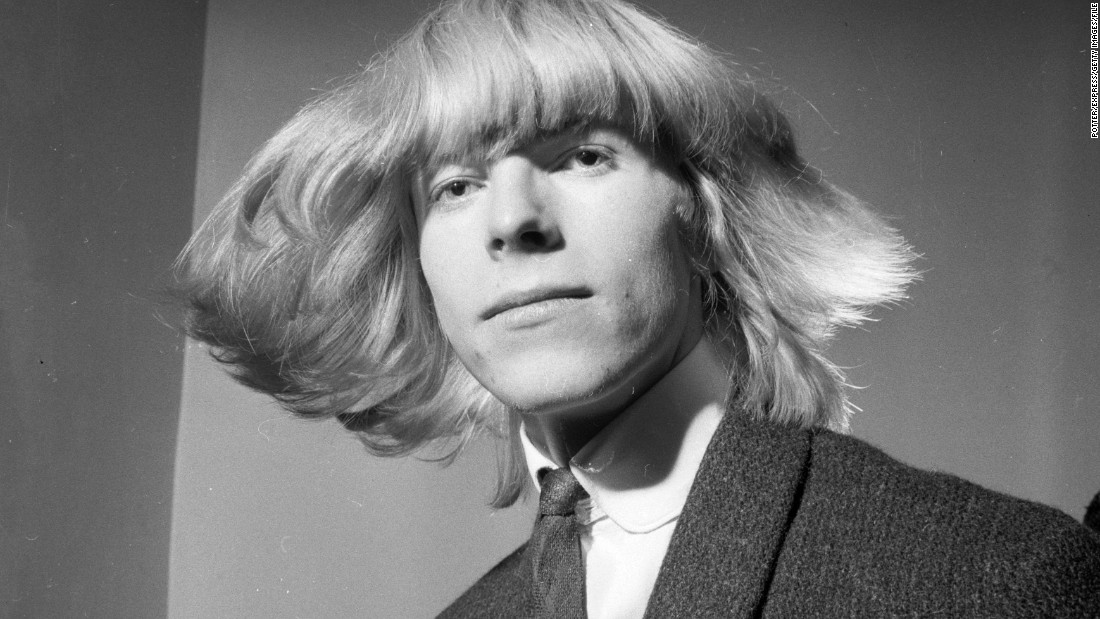 Bowie&#39;s hair and outfits shocked and awed for decades. Pictured, a young Bowie sports a Prince Valiant-esque do in March 1965, while he was still going by his birth name of Davy Jones. He changed his name to Bowie following the success of the Monkees and their lead singer Davy Jones. 