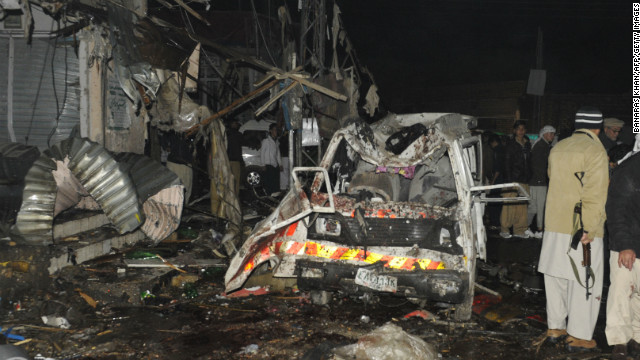 Pakistani security officials examine the site of a deadly bomb attack in Quetta on Thursday.