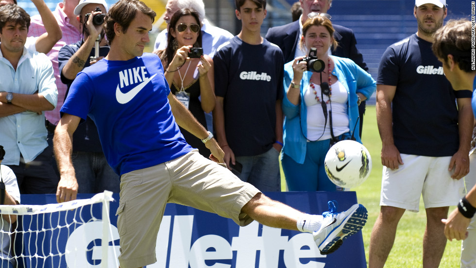 Federer controls the ball during a soccer-tennis exhibition match with Argentinian Juan Martin Del Potro and former footballer Gabriel Batistuta (both out of picture) at the Bombonera stadium in Buenos Aires.