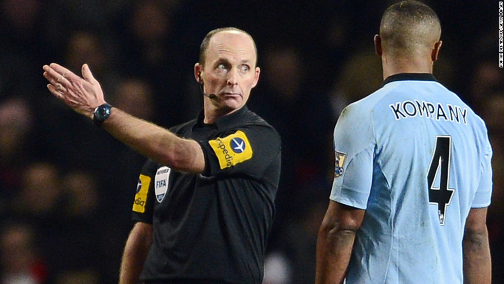 City also went down to 10 men in the second half when captain Vincent Kompany (R) was shown a red card by referee Mike Dean for his sliding tackle on Arsenal midfielder Jack Wilshere.