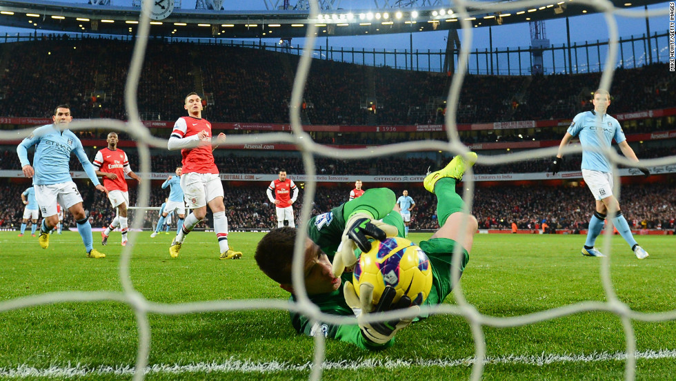 Dzeko&#39;s penalty was saved by Wojciech Szczesny, who gratefully grabbed the ball after it hit his legs and rebounded off the post. 