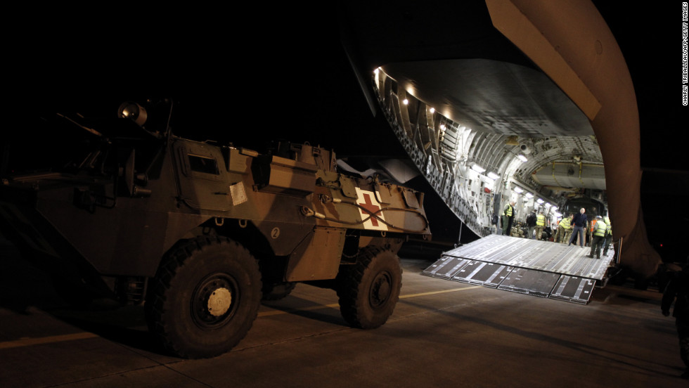 A French armored vehicle rolls onto a British army aircraft to be taken to Bamako on Sunday in Evreux.