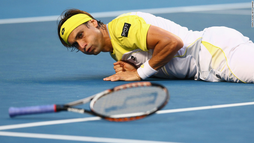 Spain&#39;s David Ferrer falls to the ground after playing a shot in his first-round match against Belgium&#39;s Olivier Rochus on January 14. Ferrer won 6-3 6-4 6-2.