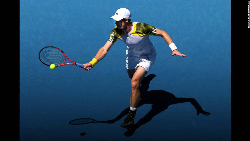 Great Britain&#39;s Andy Murray plays a forehand against Robin Haase of the Netherlands on Day 2 of the Australian Open. Murray defeated Haase 6-3, 6-1, 6-3. Murray won 6-3 6-1 6-3.