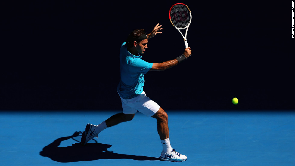 Roger Federer of Switzerland plays a backhand in his first-round match against Benoit Paire of France during Day 2 of the 2013 Australian Open in Melbourne on Tuesday, January 15. Federer defeated Paire 6-2, 6-4, 6-1.