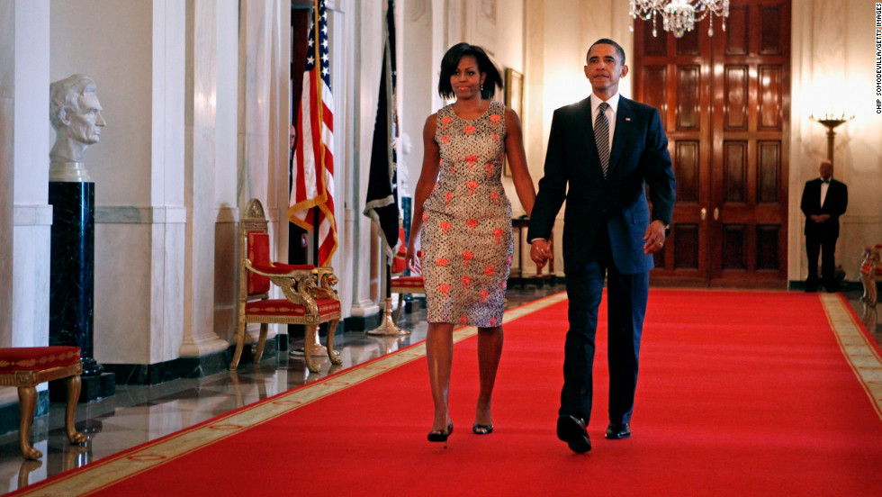 The first lady made an entrance at the 2011 Medal of Honor ceremony in a brocade dress by Barbara Tfank that she has worn on multiple occasions since, Taylor said.
