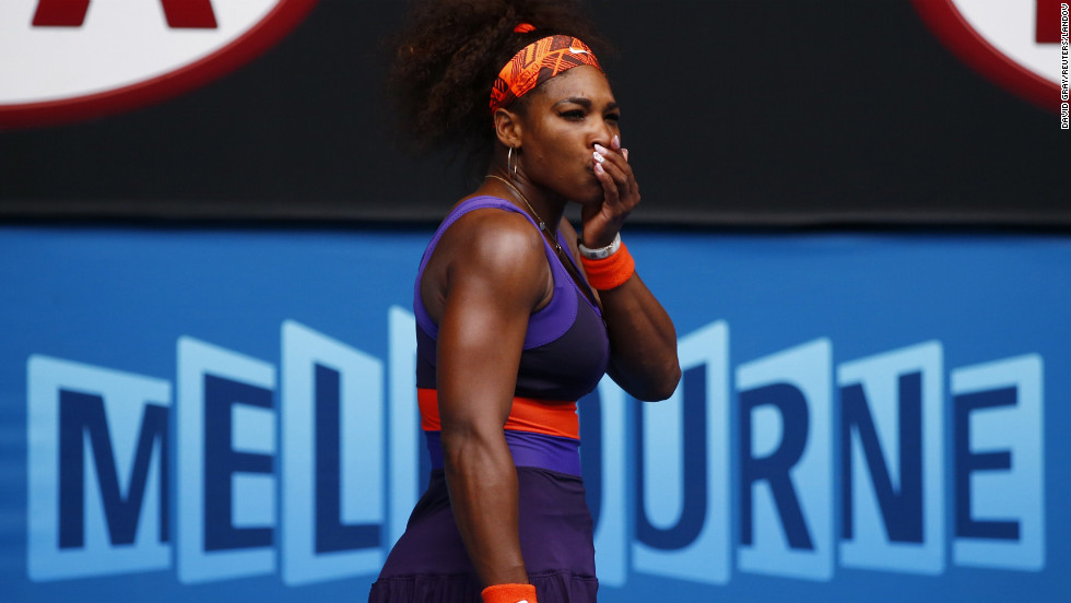 Serena Williams of the U.S. holds her mouth after hitting herself with her racket during her women&#39;s singles match against Garbine Muguruza Blanco of Spain during Day Four of the 2013 Australian Open on Thursday, January 17, in Melbourne, Australia. Williams won 6-2, 6-0.