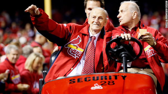 Stan Musial waves to fans during the 2012 National League Championship Series.
