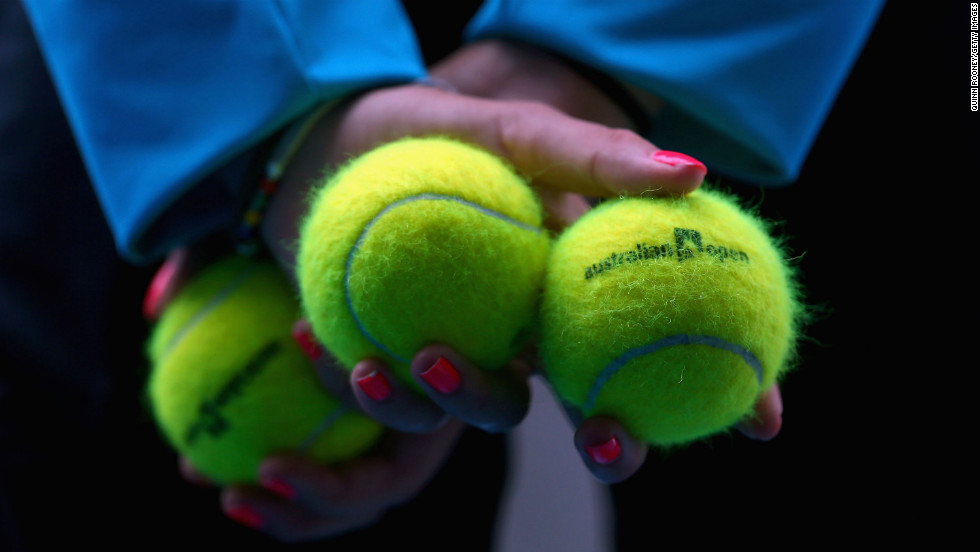 A ball kid displays Australian Open tennis balls during a match on January 21 at Melbourne Park.