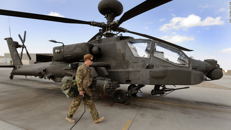Harry inspects an Apache helicopter on October 30, 2012.