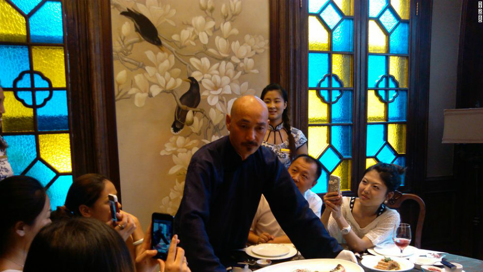 Dressed as Chiang Kai-shek,  Xu Jinshui showcases food popular during the Republican period at a restaurant in Nanjing.