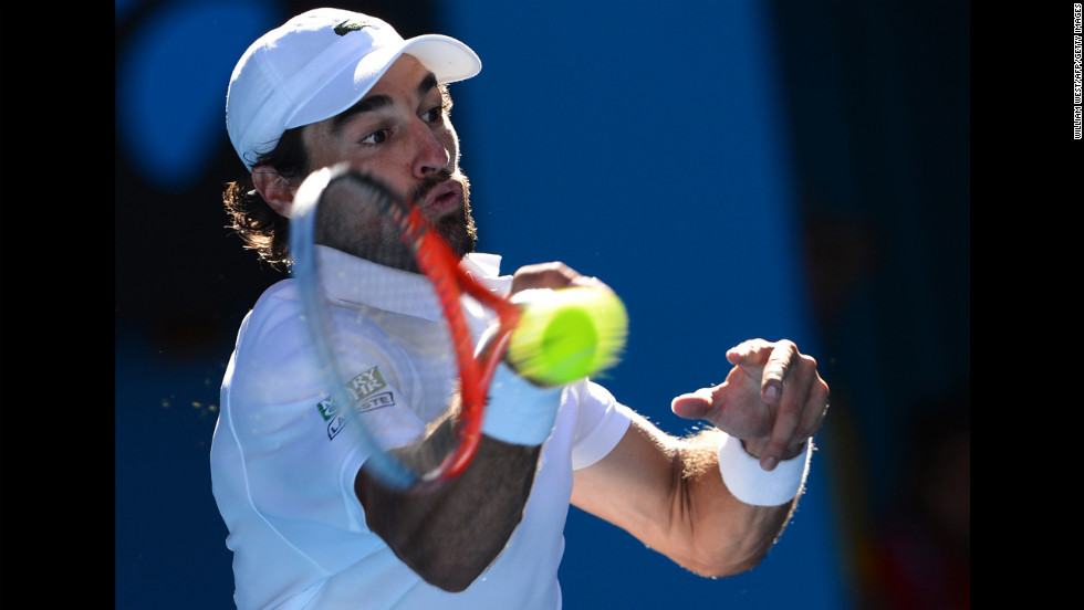 France&#39;s Jeremy Chardy hits a return against Britain&#39;s Andy Murray during their men&#39;s singles match on January 23. Murray defeated Chardy 6-4, 6-1, 6-2.