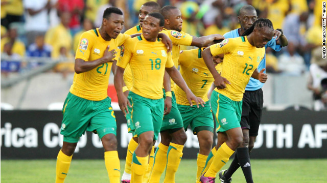 South Africa&#39;s players celebrate on their way to a 2-0 win over Angola in Durban Wednesday.