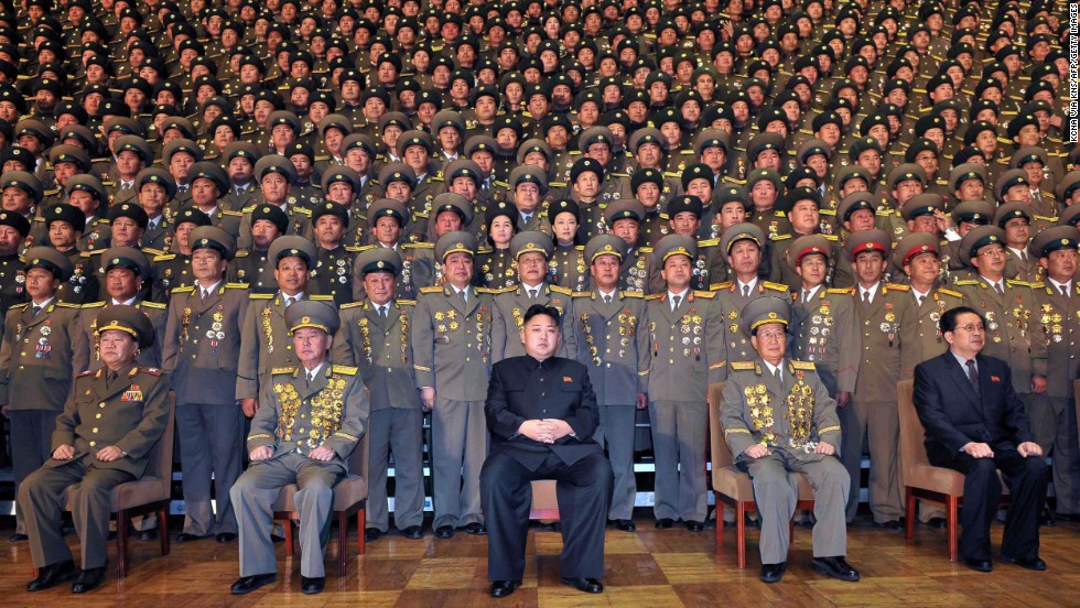 Kim, center, poses in this undated picture released by North Korea&#39;s official news agency in November 2012.