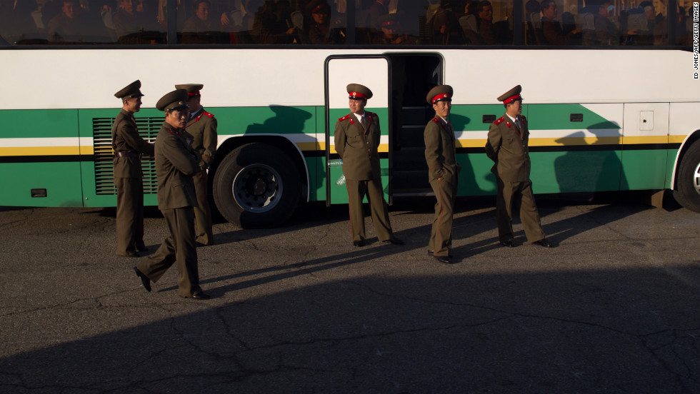 Soldiers board a bus outside a theater in Pyongyang in April 2012.