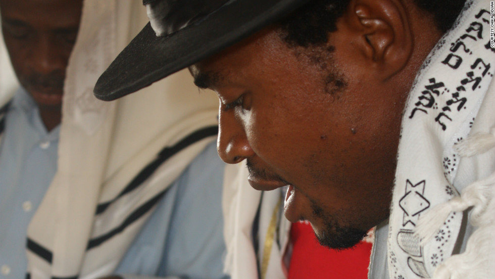 A prayer leader at a synagogue near Abuja reads from the Torah. (Courtesy: Chika Oduah.)