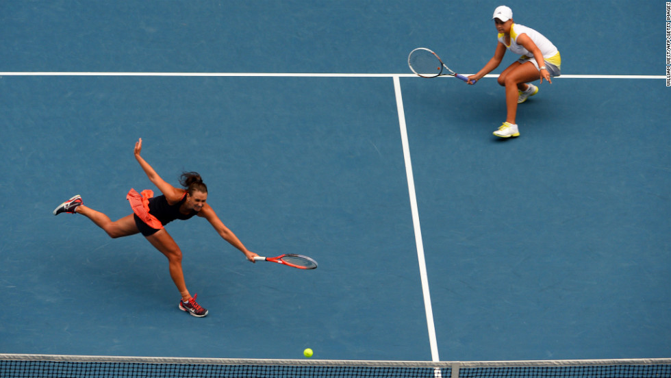 Ashley Barty of Australia, right, watches as compatriot Casey Dellacqua plays a return during their women&#39;s doubles final against Sara Errani and Roberta Vinci of Italy on day 12 of the Australian Open in Melbourne on Friday, January 25. The Italian pair beat Barty and Dellacqua 6-2, 3-6, 6-2.