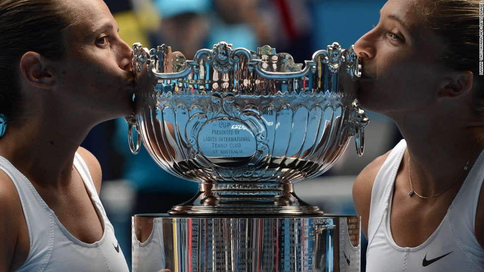 Italy&#39;s Roberta Vinci, left, and Sara Errani pose with the winner&#39;s trophy after their victory over Australia&#39;s Ashleigh Barty and Casey Dellacqua on January 25.