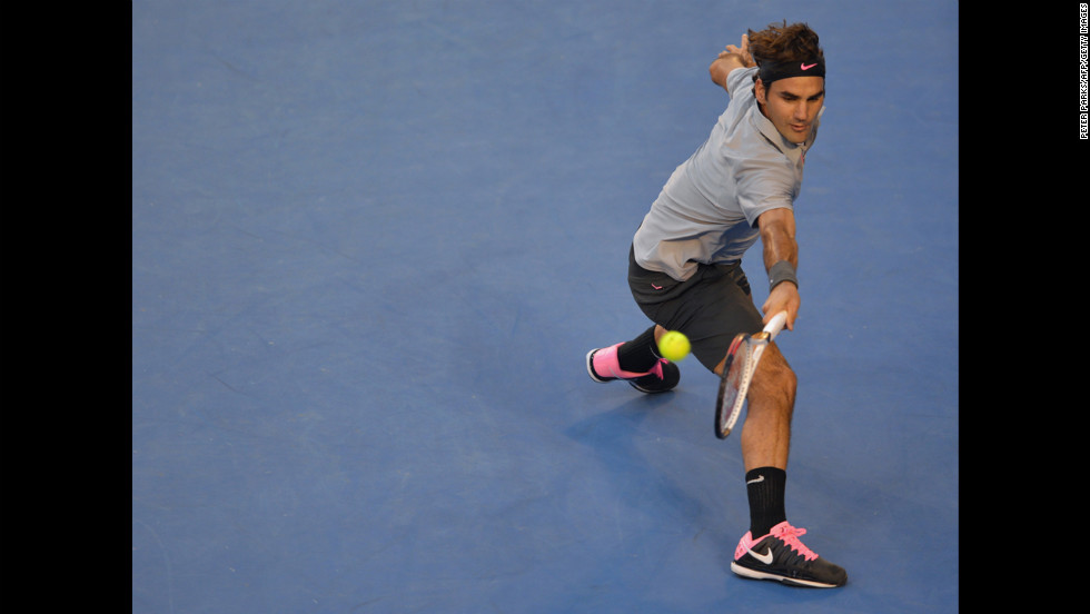 Roger Federer hits a return on January 25.