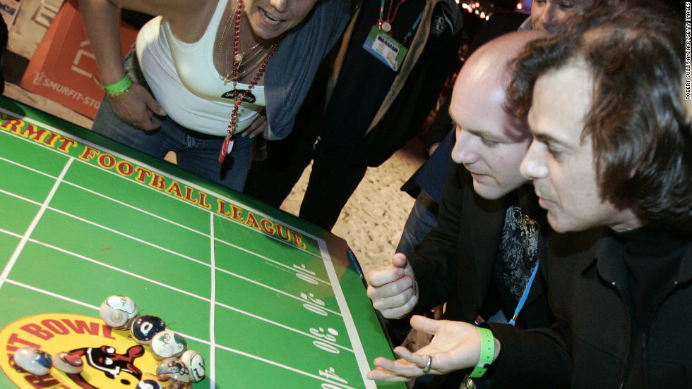 Regionally unique games, like this hermit crab race during Super Bowl XLI at Miami&#39;s Dolphins Stadium, add local flair to the party.