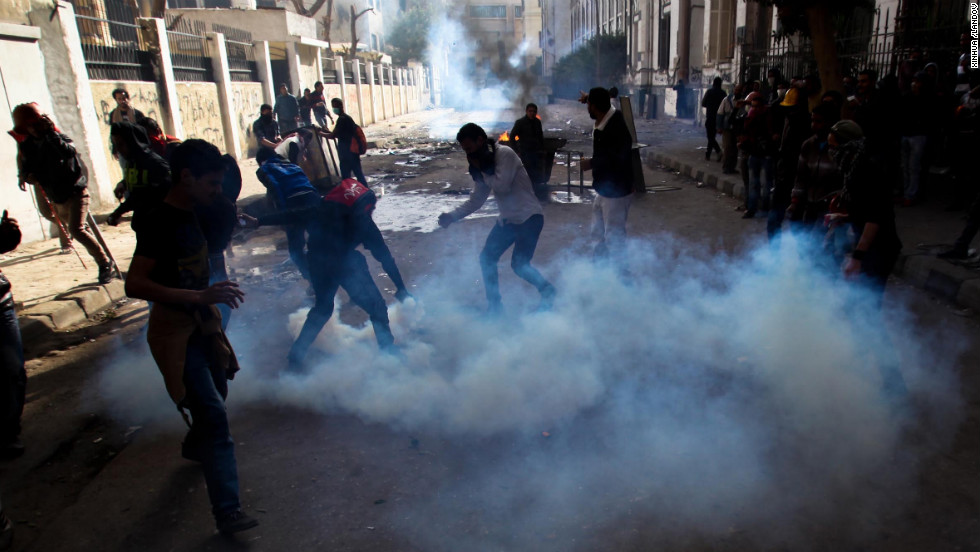 Protesters and football fans clash with riot police near Egypt&#39;s interior ministry.