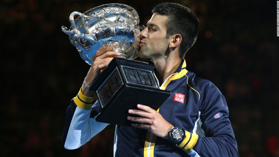 Djokovic holds the Norman Brookes Challenge Cup on January 27.