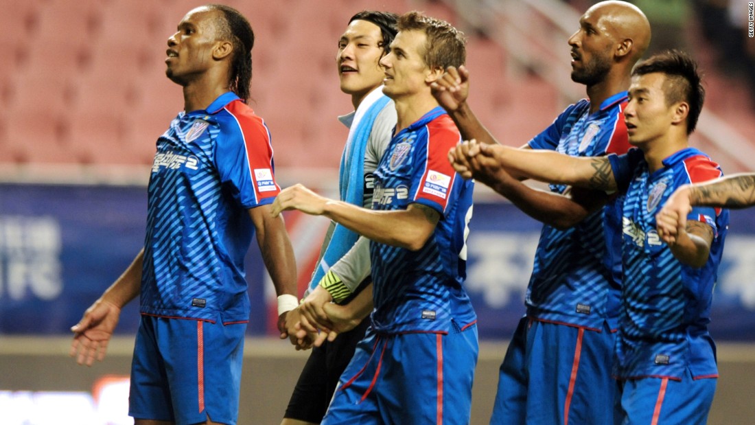 Didier Drogba (far left) and Nicolas Anelka (second from right) attending a training session in Shanghai. Their spells in China didn&#39;t last long though and the pair exited in 2013. 