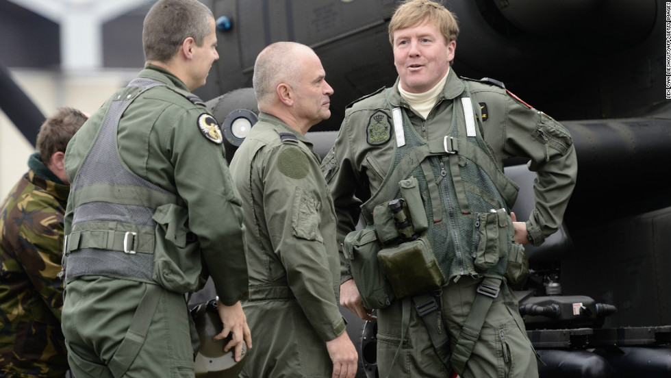 Willem-Alexander (right) talks to soldiers during a visit to Gilze Rijen airbase on November 13, 2012.