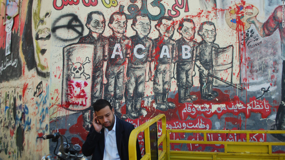 The Ahlawy played a crucial role in Egypt&#39;s two-year-old revolution. Graffiti honoring them and the dead can be seen throughout Egypt. This piece of graffiti next to Tahrir Square shows a line of police, each with the former dictator Hosni Mubarak&#39;s face. The acronym ACAB stands for &quot;All Cops Are Bastards.&quot;