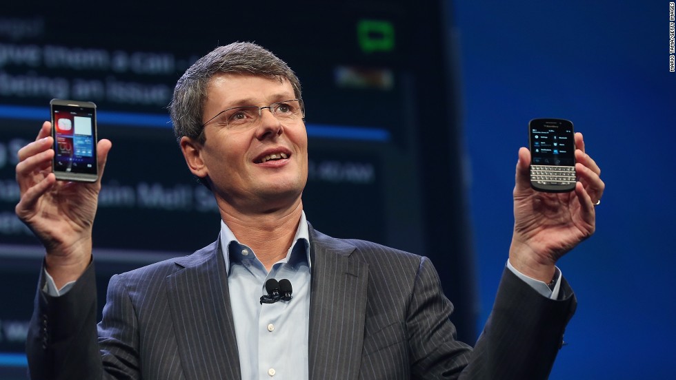 BlackBerry CEO Thorsten Heins displays two new Blackberry 10 smartphones January 30 in New York. The Z10, left, features an all-touch keyboard. The Q10 features a classic BlackBerry tactile keyboard.