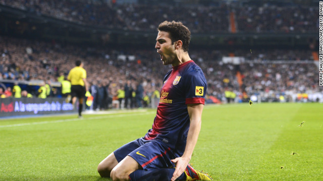 Barcelona&#39;s Cesc Fabregas celebrates after giving his side the lead at the Santiago Bernabeu.