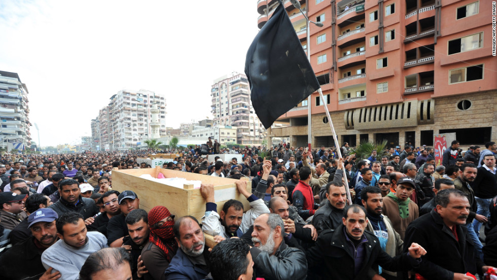 Mourners carry the coffins of six people killed in clashes after the soccer riot ruling in Port Said on Monday, January 28. Rage exploded when a judge sentenced to death 21 residents of Port Said for roles in a deadly 2012 soccer riot.
