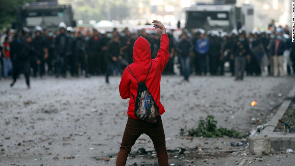 A protester faces off against riot police during clashes near Cairo&#39;s Tahrir Square on Wednesday, January 30.