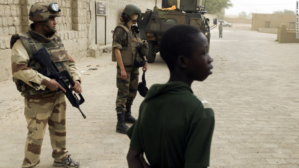French soldiers patrol next to the Djingareyber mosque, on January 31, in Timbuktu, Mali. The city was recaptured on January 28, by French-led forces in their offensive against Islamist rebels who have been occupying Mali&#39;s north since last April. 